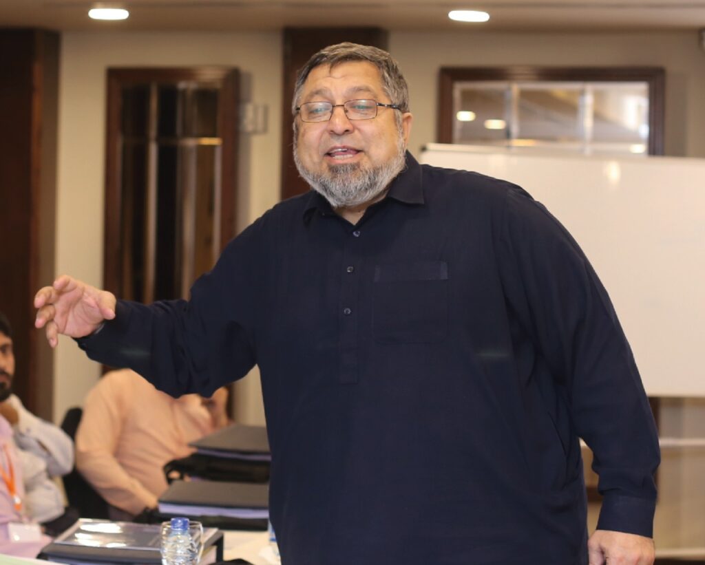 An Al-Qadir University faculty member teaching