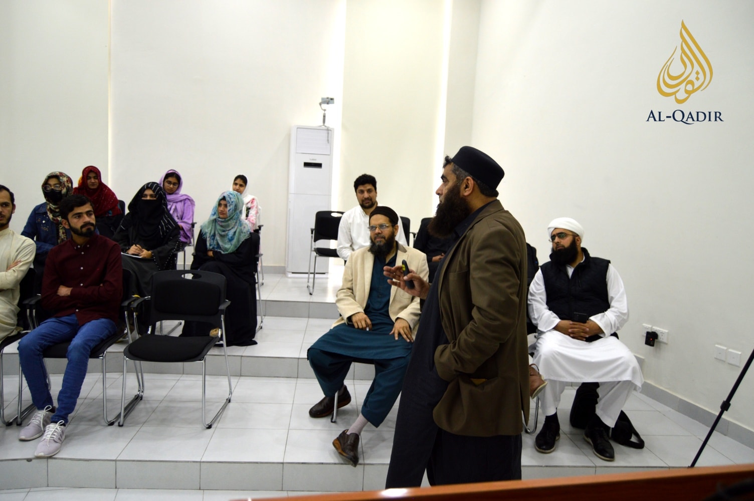 Students and faculty at a campus seminar